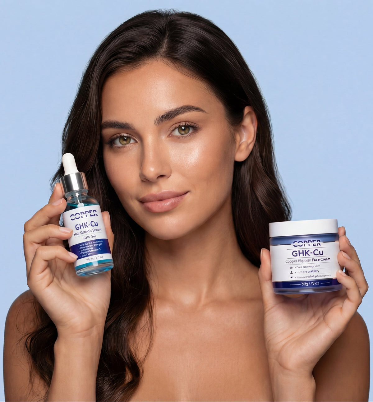 Copper Theory model holding GHK-Cu hair serum and copper peptide face cream on soft blue background